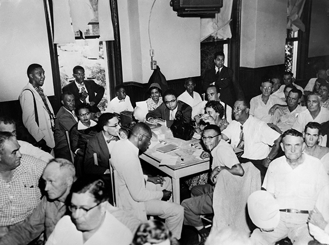 A group of people at the Till trial, including Mamie Till and African American Journalists.